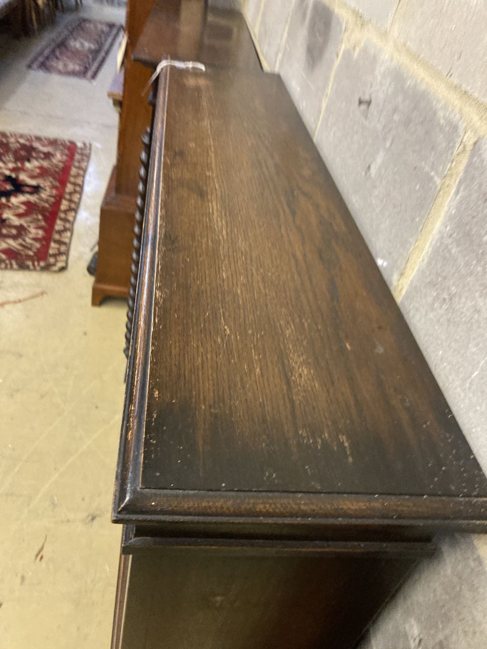 A 1920s oak open fronted bookcase, width 110cm depth 26cm height 141cm
